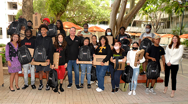 UM First Star Academy Surprised Foster Teens with Laptops and Opportunity in Partnership with T-ROC and One Laptop Per Child